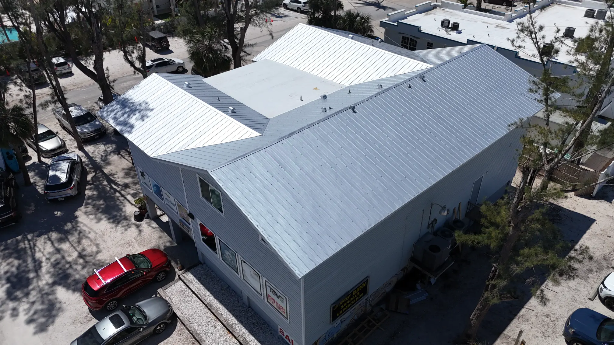 5V Crimp Metal and TPO Roof Replacement at West Coast Surf Shop in Holmes Beach